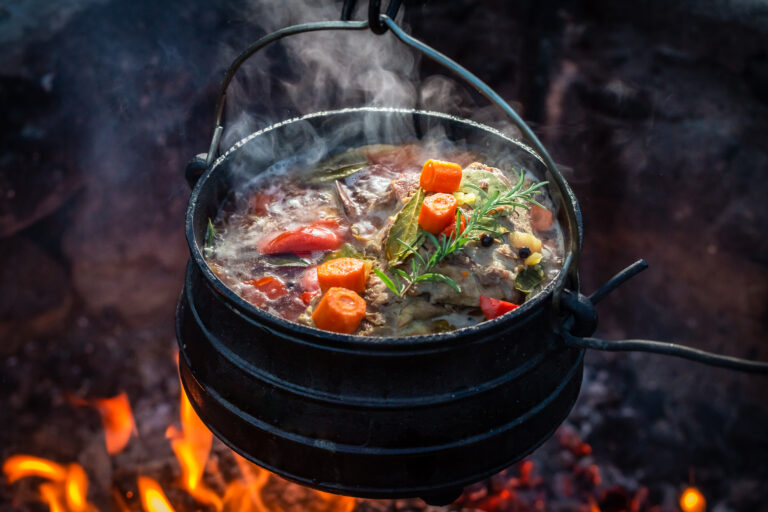 delicious and hot hunter's stew on bonfire.