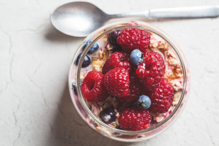 overnight oatmeal with berry, peanut butter and maple syrup in j